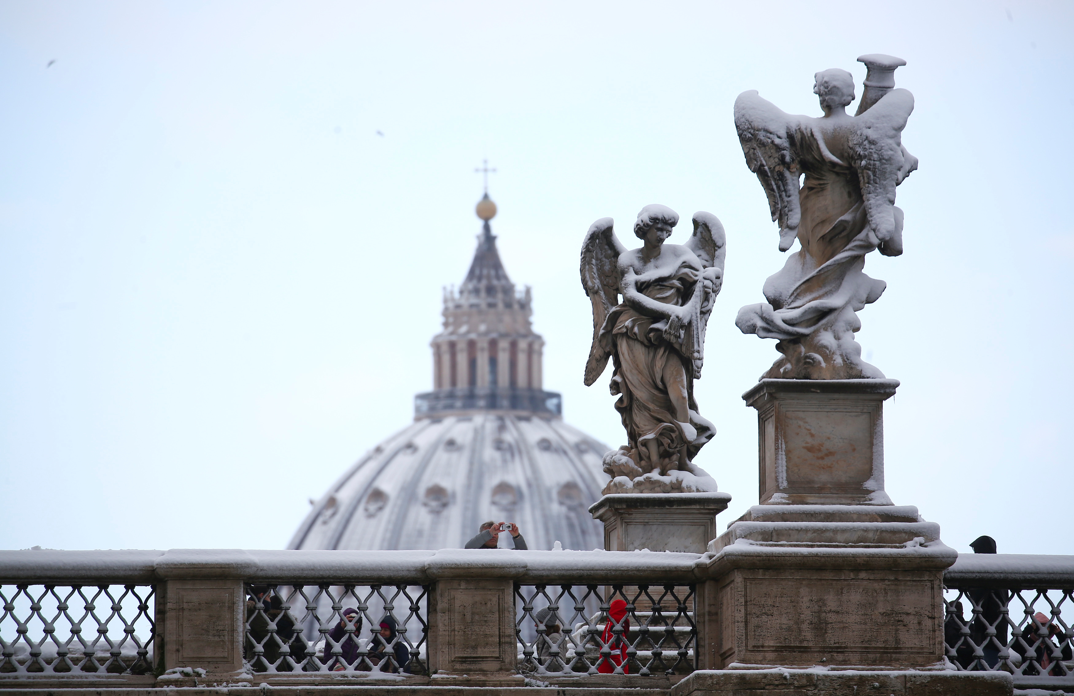 Statues are seen covered by snow during a heavy snowfall in Rome, Italy February 26, 2018. REUTERS/Alessandro Bianchi